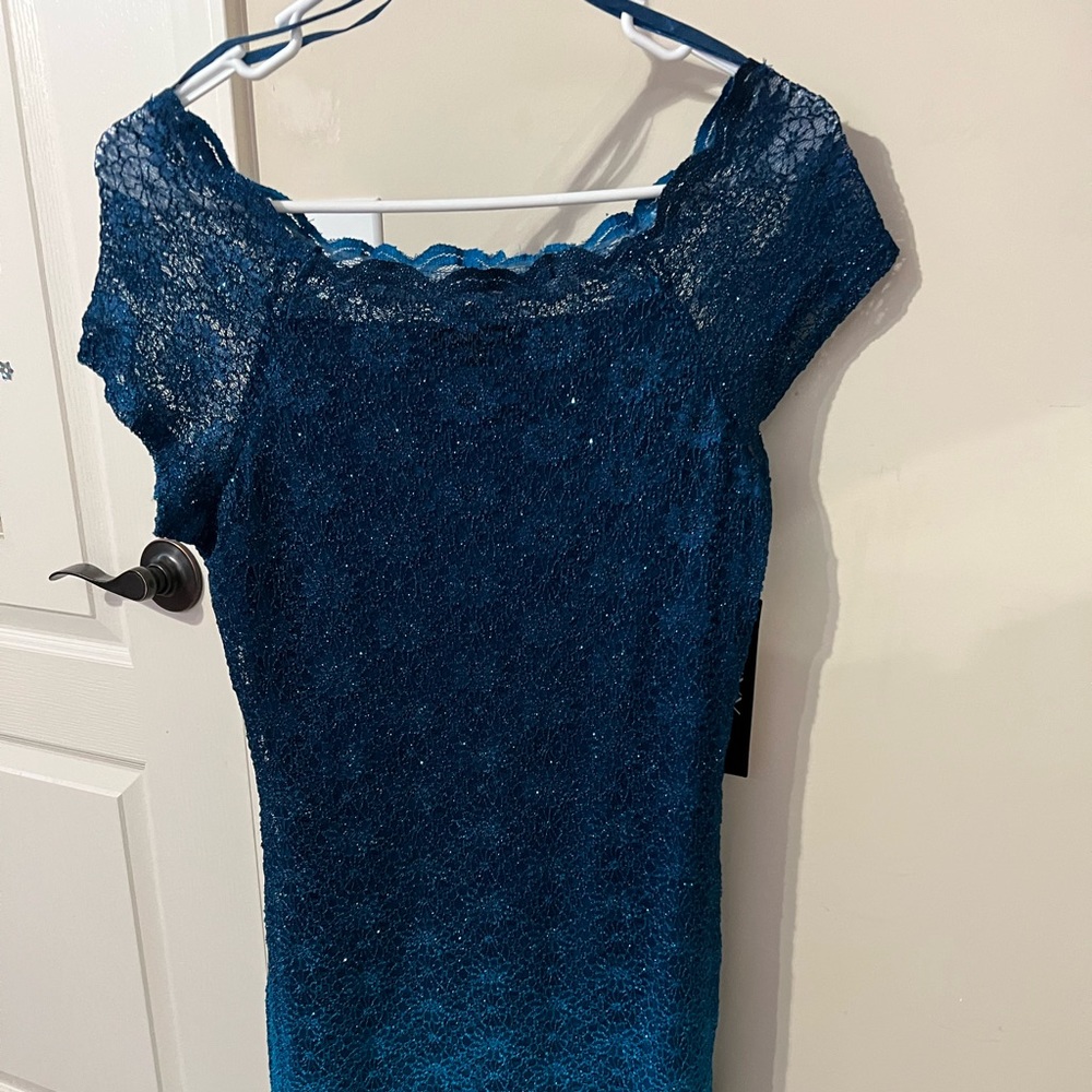 ONXY nite Blue dress size 4, never been worn.